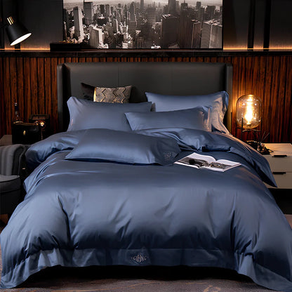 Four-piece cotton bedding set with satin weave fabric showing quilting detail and colour options