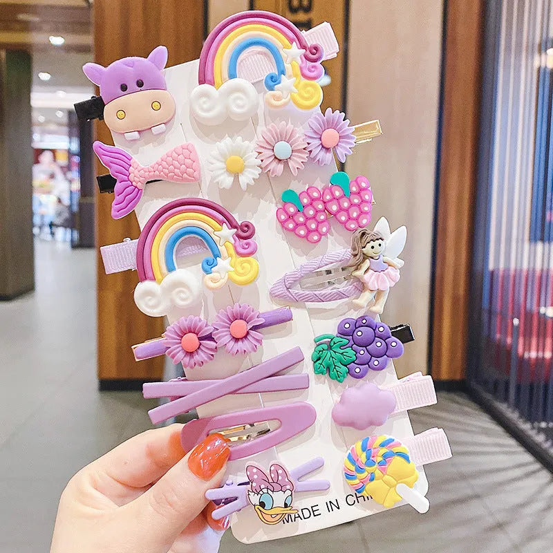 Assortment of colourful toddler hair clips and barrettes with candy, rainbow, fruit, and butterfly designs