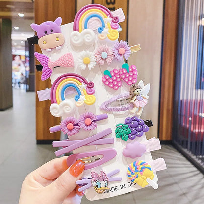 Assortment of colourful toddler hair clips and barrettes with candy, rainbow, fruit, and butterfly designs