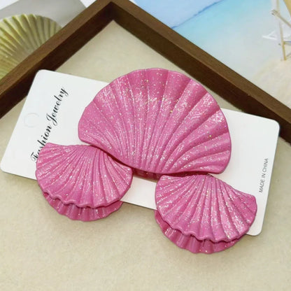 Gradient frosted plastic hair clip set in three pieces with shell decoration