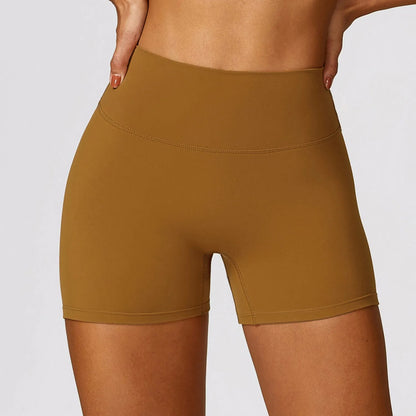 Women's high waist yoga shorts in nylon fabric with belly contracting design and hip lifting cut