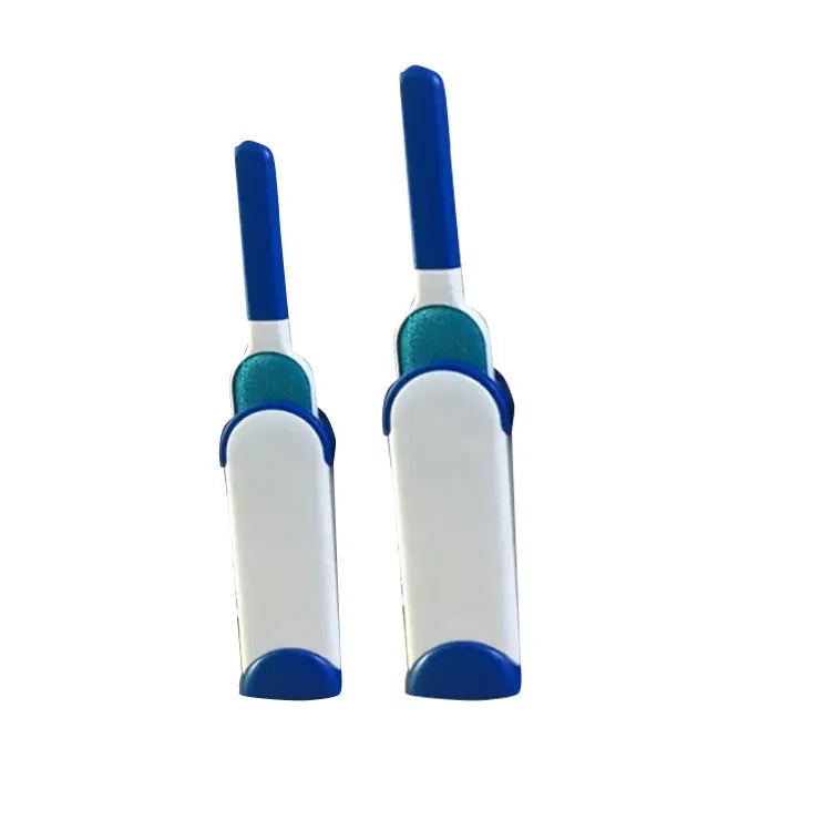 Blue reusable pet hair removal brush with double-sided head next to its self-cleaning base.