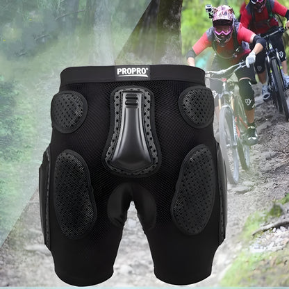 Black cycling hip protection pants shown laid flat, designed for impact safety during sports.