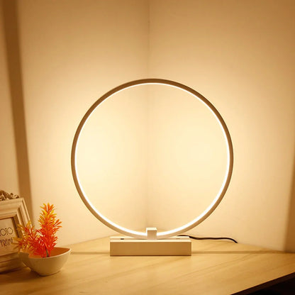 Modern 25cm diameter white LED bedside lamp with acrylic frame and iron base, emitting cool or warm white flicker-free light