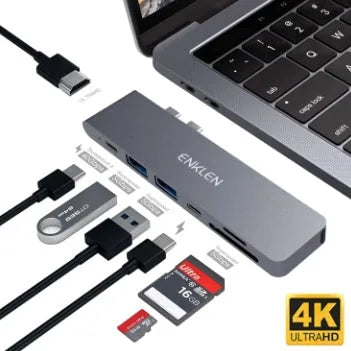 Silver aluminium USB-C hub adapter with SD card slot, Micro SD slot, HDMI, USB ports, and USB-C connector.