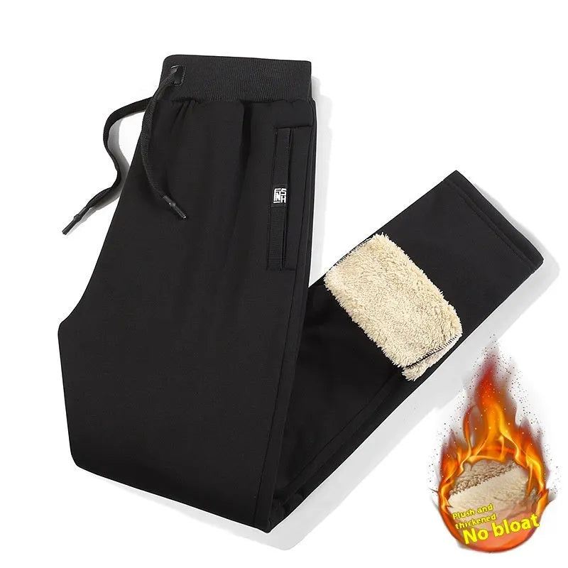 Men's grey fleece-lined cotton track pants with an elasticated waist, shown in an oversized fit.