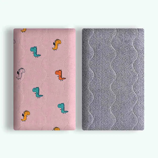 Double-sided cotton wool pet blanket in dinosaur print showing reversible construction