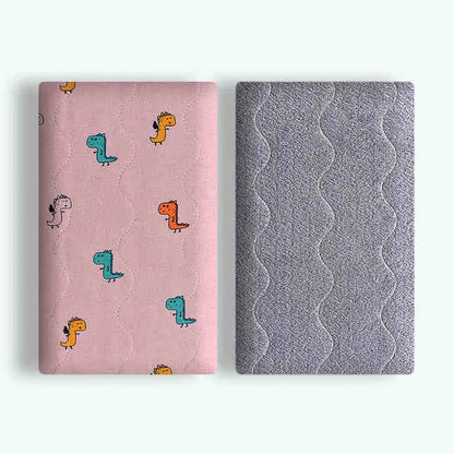 Double-sided cotton wool pet blanket in dinosaur print showing reversible construction