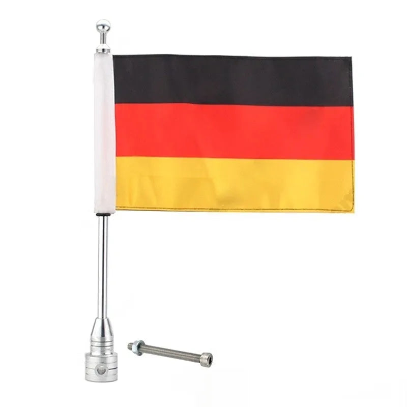 Motorcycle tail box flagpole for mounting on luggage carrier, in black or silver finish.