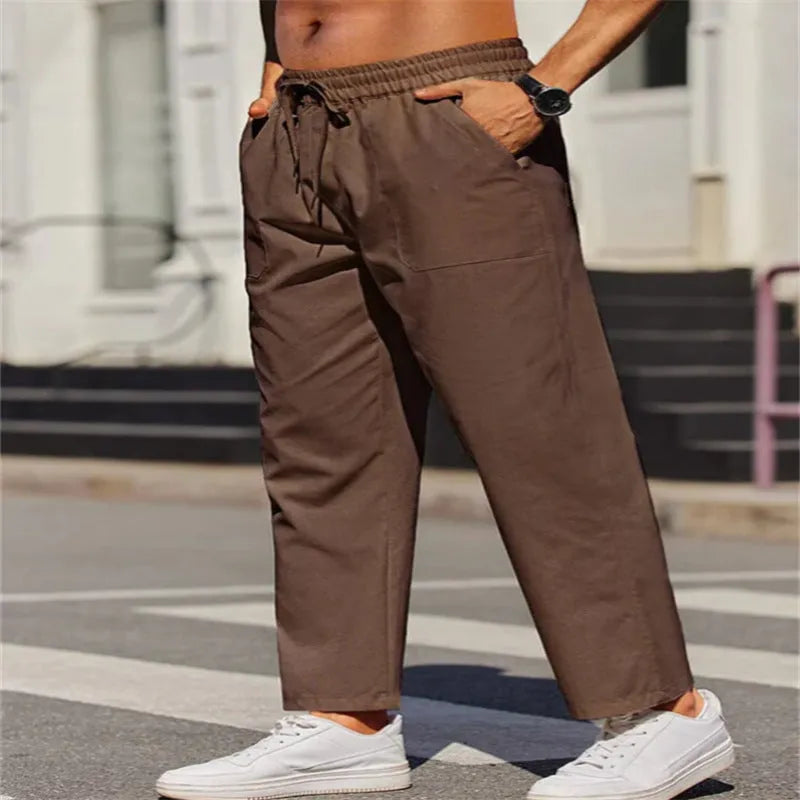 Men's straight-leg linen trousers with an elastic waist in a solid colour