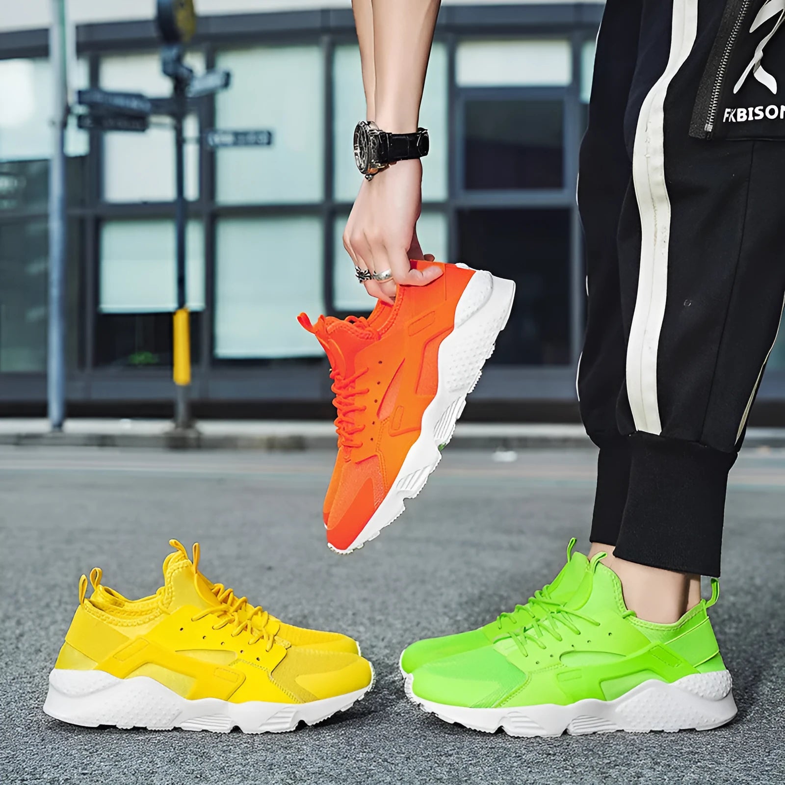 Men's low top casual shoes with mesh upper, cross shoulder straps, and flat heel in fluorescent colours