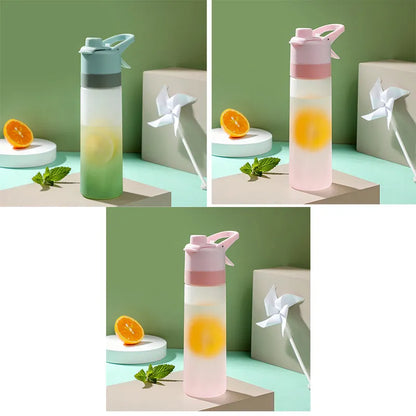 White spray water bottle with black leakproof lid and handle strap on a table