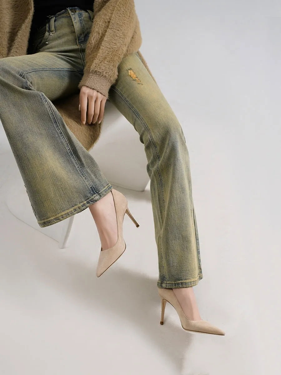 Women's black and nude pointed toe high heel slip-on pumps with soft sole.