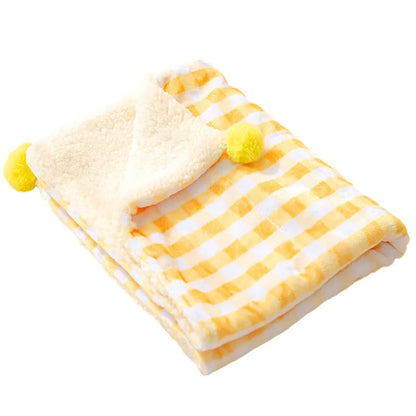 A blue coral fleece pet blanket laid flat, showing its soft texture and rectangular shape as a dog or cat bed mat.
