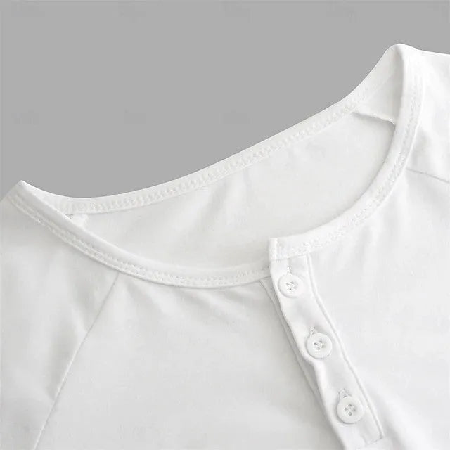 Men's white long-sleeved t-shirt with a Henry collar laying flat