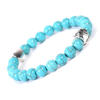 Tiger's eye stone bracelet with dog paw and Indian agate beaded designs on a wrist.