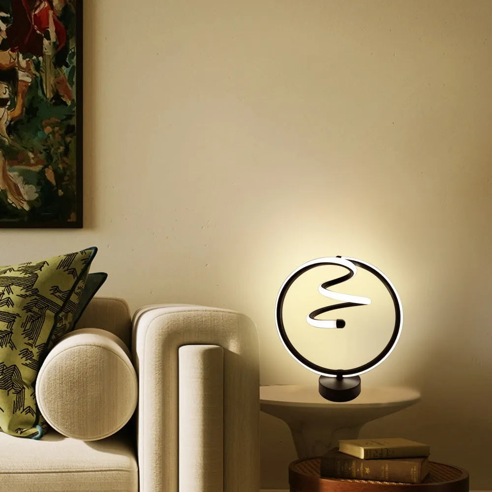 Black remote-controlled LED night light with Bluetooth remote on a bedside table.