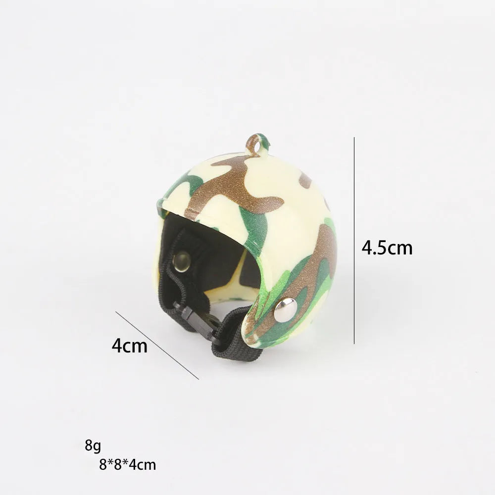 Small hard plastic helmet with elastic straps and sponge lining, designed for a chicken or bird to wear.