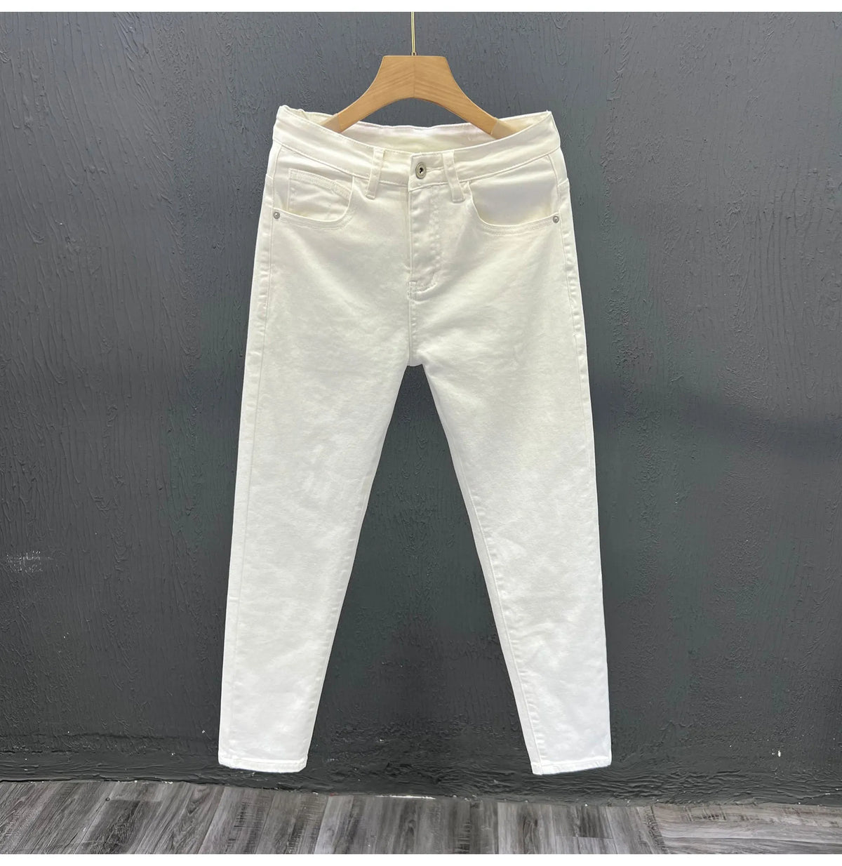 Men's white slim fit jeans with mid to low waist, micro elastic denim and small straight leg