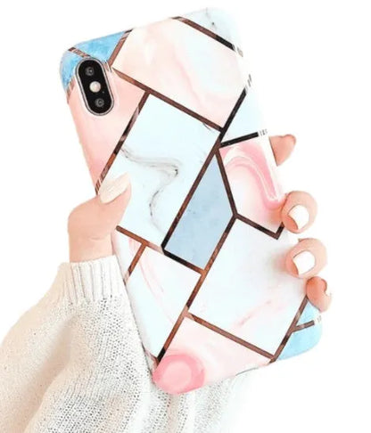 Clear silicone gel mobile phone case for iPhone models on a table