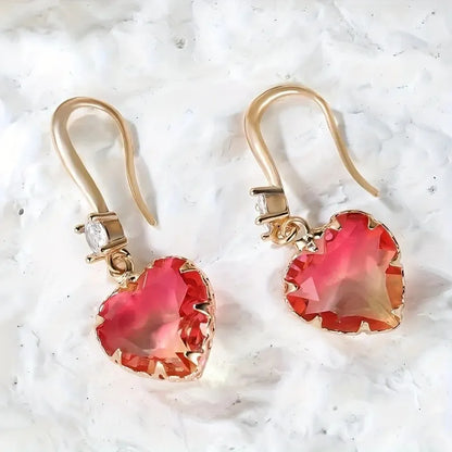 Coloured glass crystal heart-shaped earrings for women in blue, yellow, purple, and red styles.