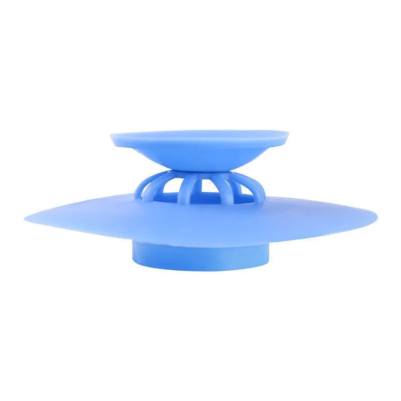 UFO-style silicone press sink drain cover in white, pink, gray, blue, and green