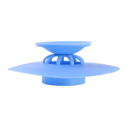 UFO-style silicone press sink drain cover in white, pink, gray, blue, and green