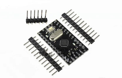 Mini Pro microcontroller board showing 14 digital I/O pins, 8 analog inputs, and Atmega328P chip on 33.3mm x 18.0mm green PCB