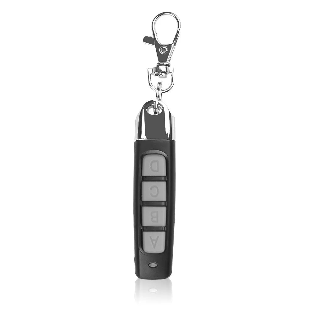 Rolling door remote control transmitter in four colour options showing compact 6.7cm design