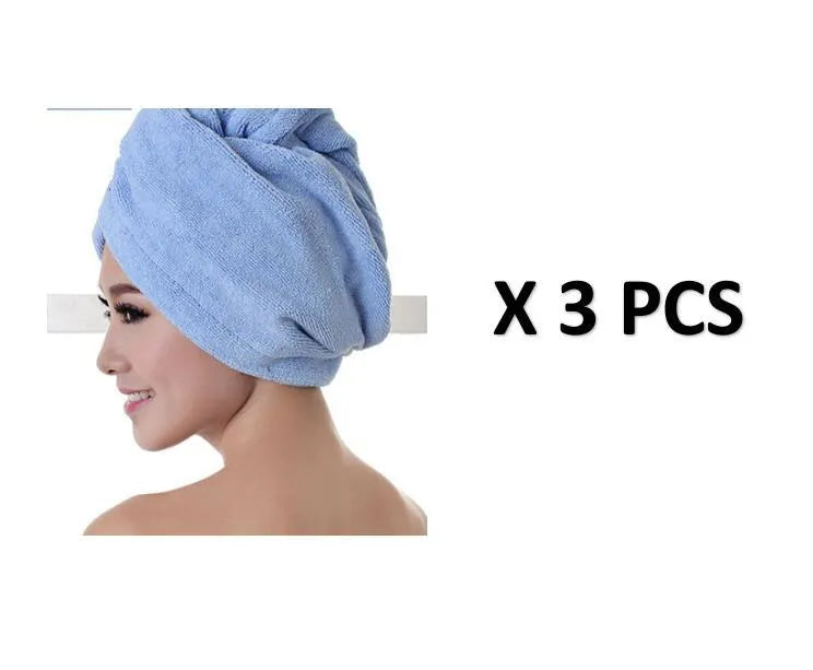 A woman wearing a sky blue microfiber hair dryer cap, with wet hair tucked inside, showing the towel's wrap-around design.