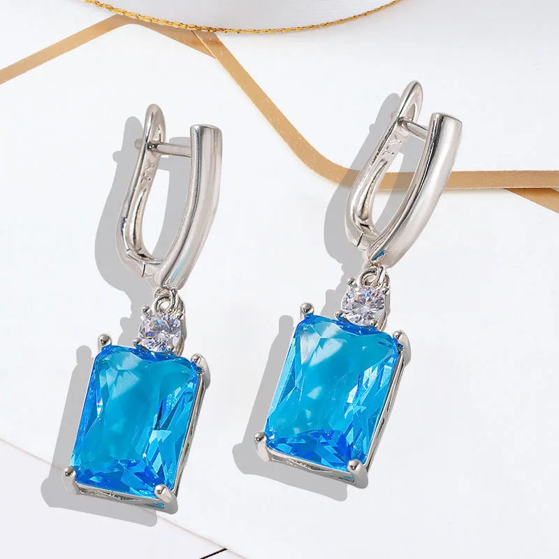 Square geometric earrings with gold electroplated finish on copper base