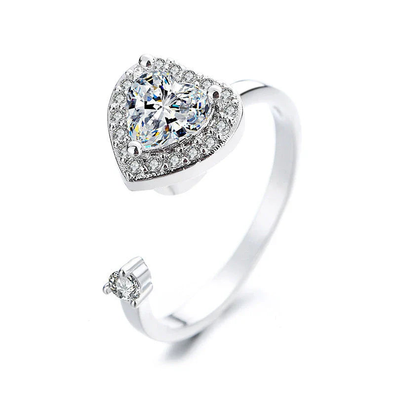 Adjustable spinner ring with rotating floral, geometric, and nature-inspired motifs for women's fashion and stress relief