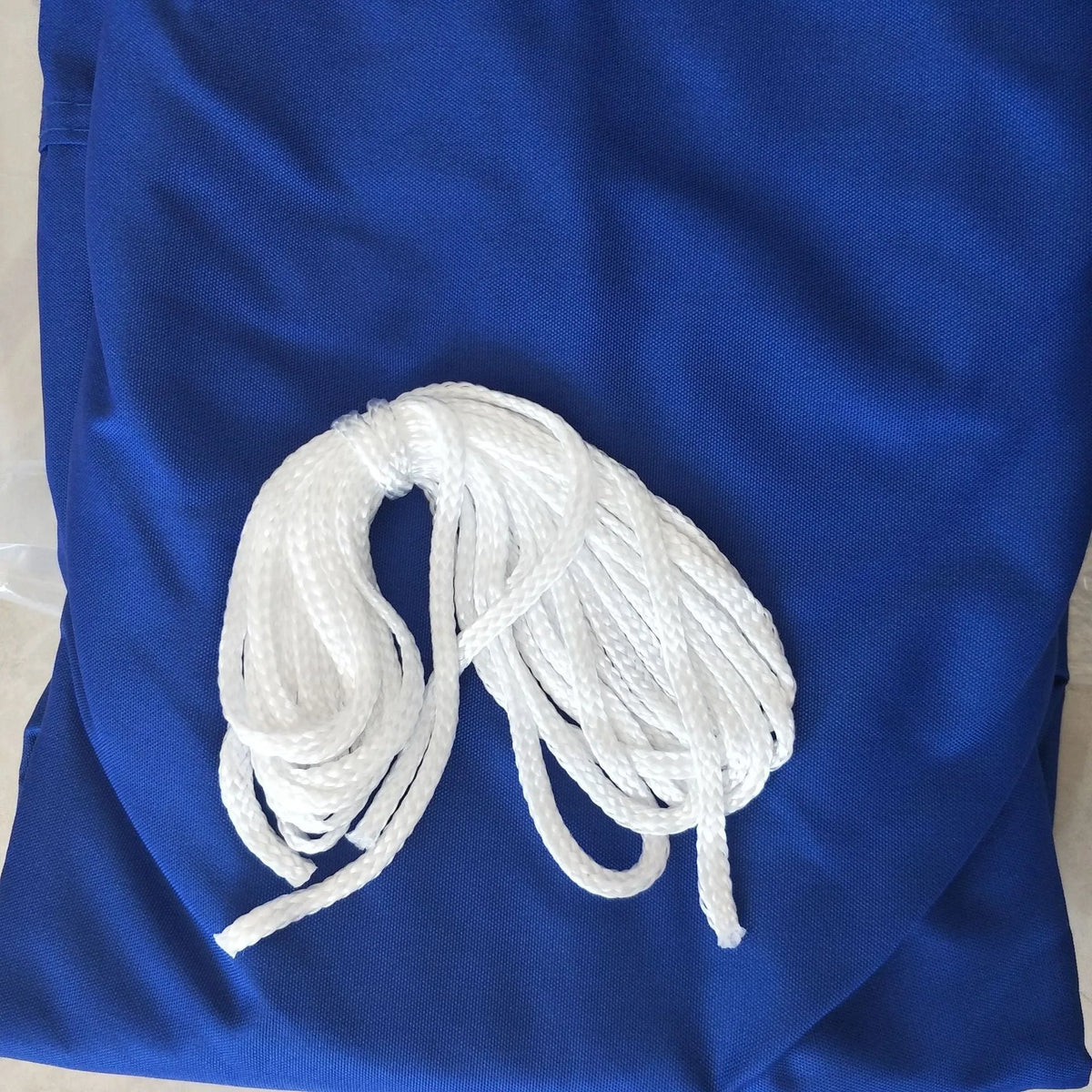 Blue polyester shade sail measuring 3x4 metres with curved square shape