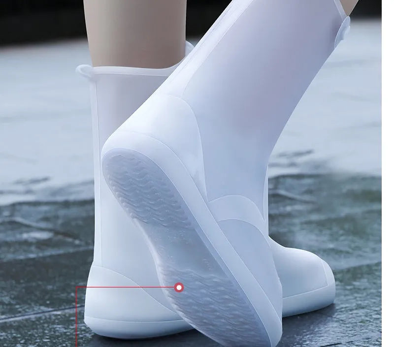White high-top PVC waterproof shoe cover for women, shown on a foot.