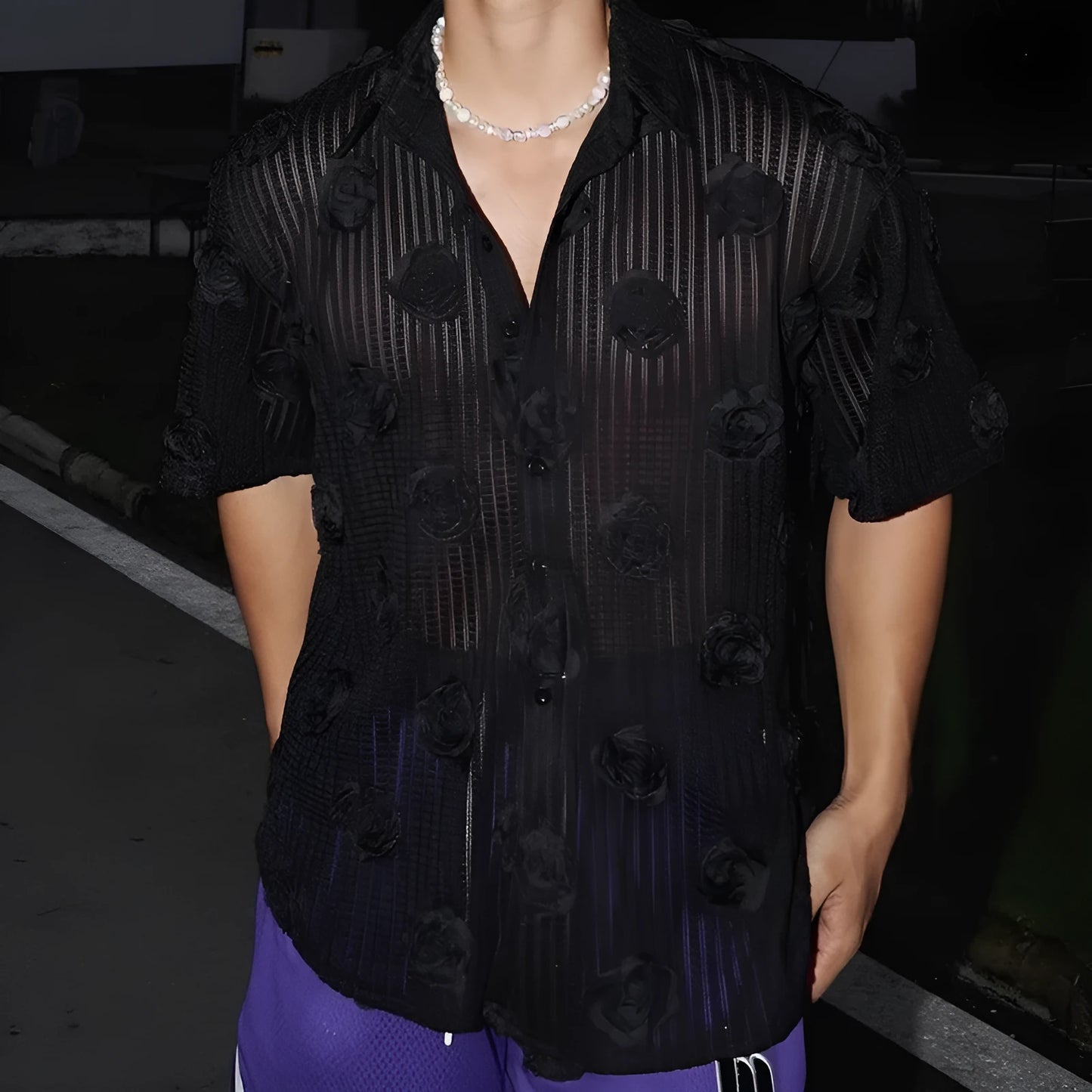 Men's loose fit floral print short sleeve shirt in black with a wool lining, shown on a mannequin.