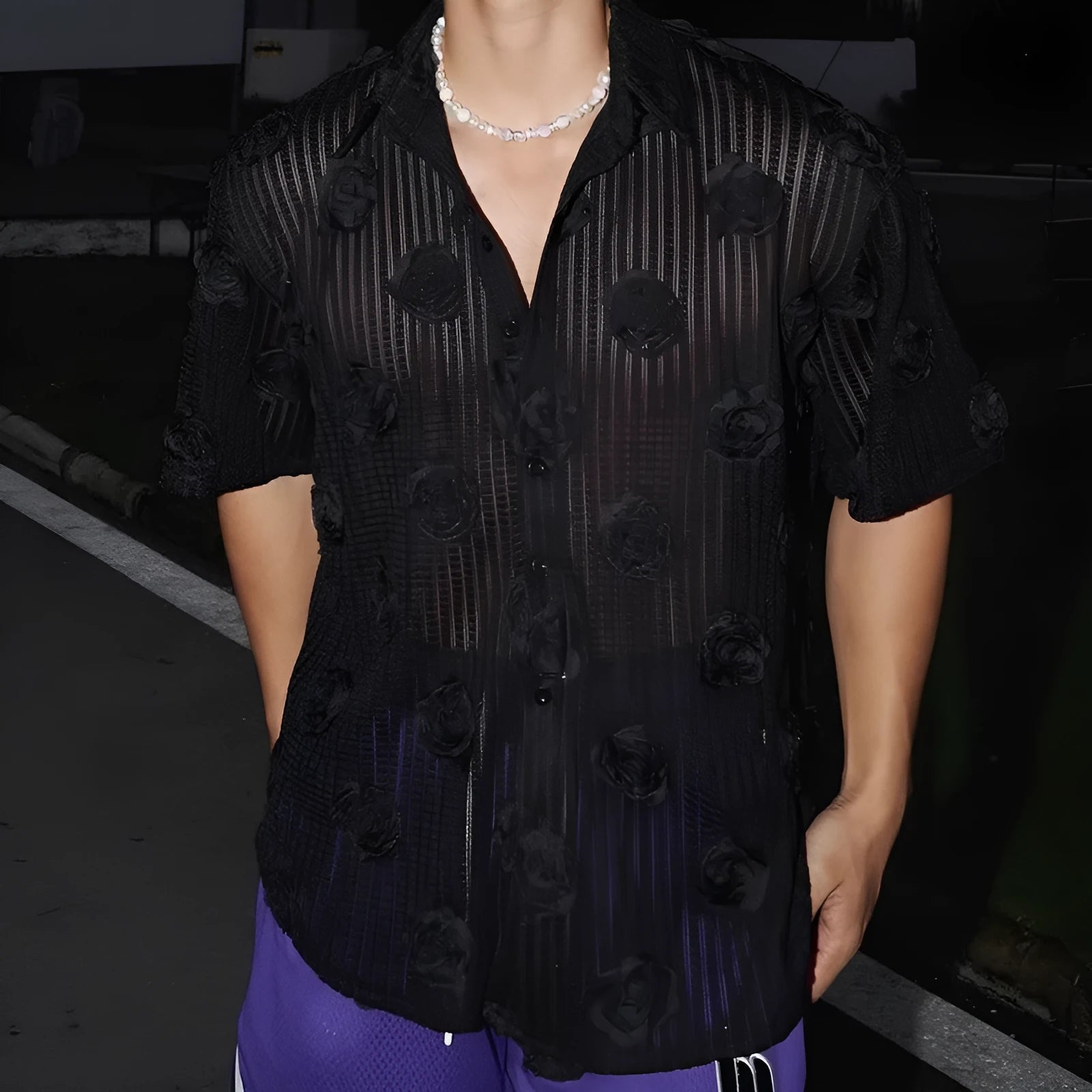 Men's loose fit floral print short sleeve shirt in black with a wool lining, shown on a mannequin.