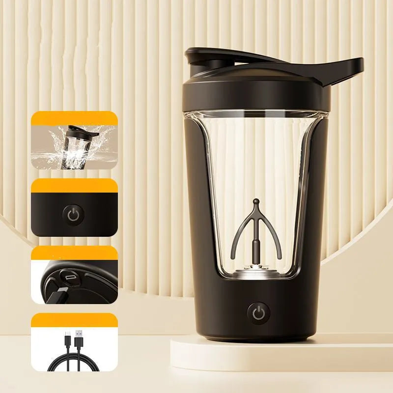 Black electric protein shaker cup with lid on a gym towel, showing USB charging port.