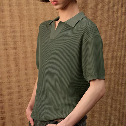 Short sleeve men's polo shirt in grey with striped collar, shown on a hanger.