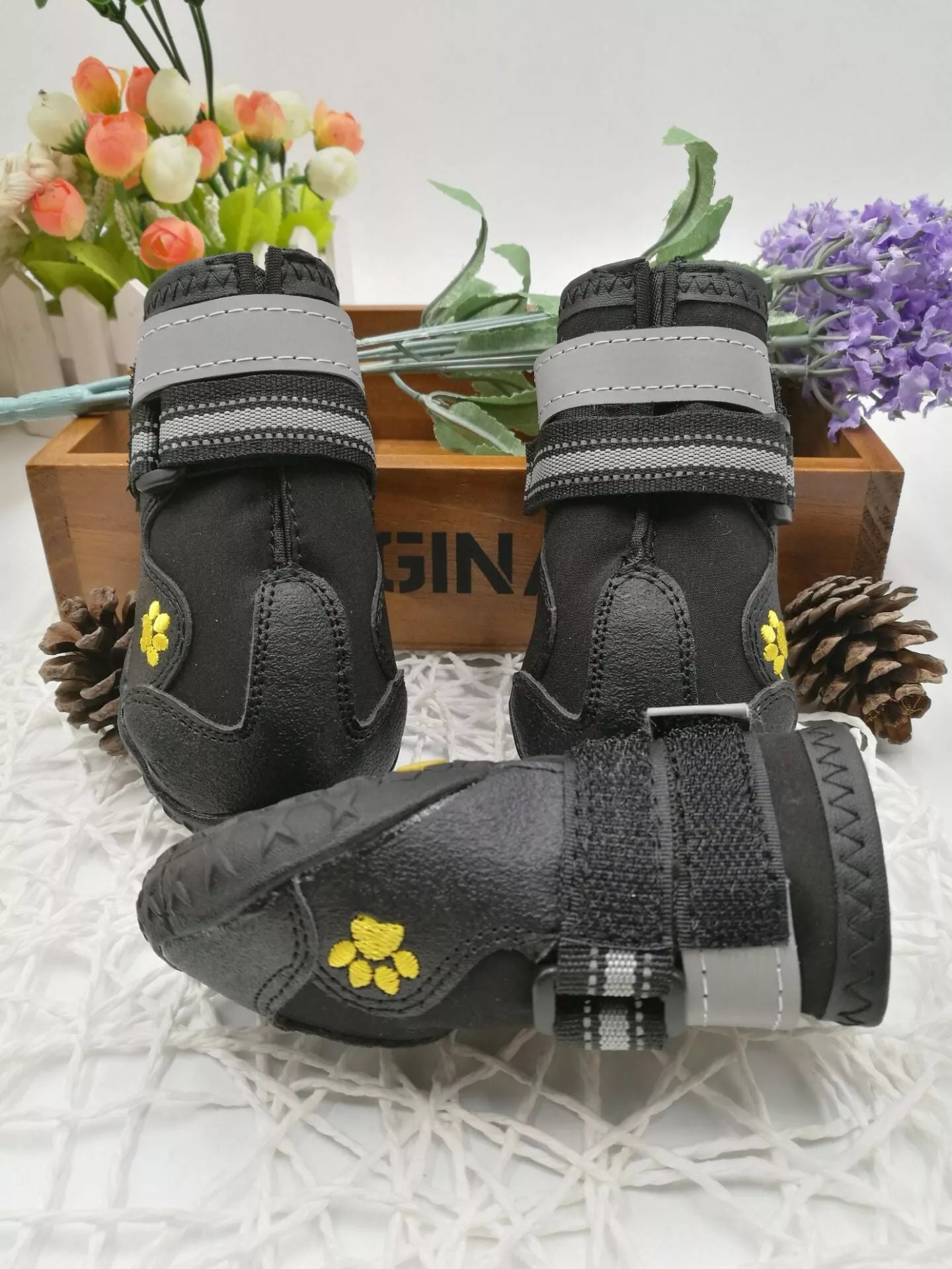 Black waterproof dog shoes with non-slip soles and adjustable fuzzy belt