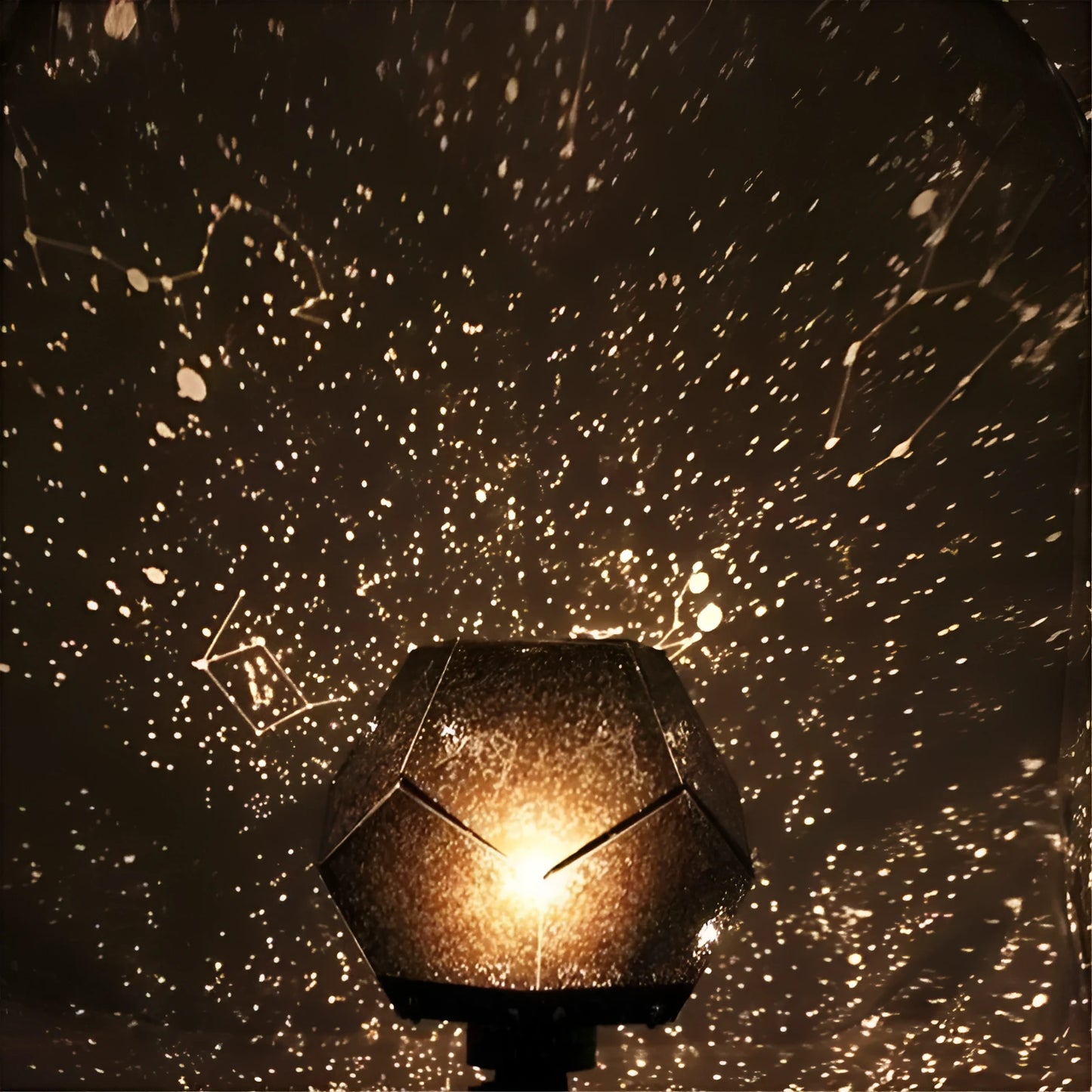 Plastic starry sky projection night light showing constellations on a bedroom ceiling, with remote control.