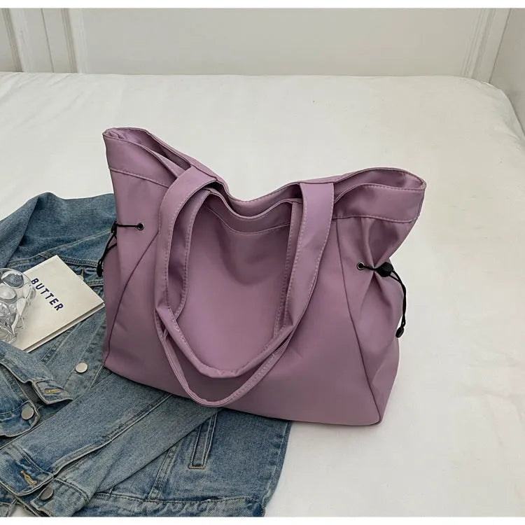 Soft Oxford cloth foldable commuter tote bag in street trend style, shown in available colours.