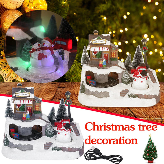 Illuminated Christmas village house with rotating Santa, Snowman, and Christmas tree decorations and playing holiday music