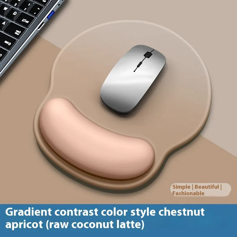 Silicone mouse mat with integrated wrist rest in a gradient blue black colour on a desk.