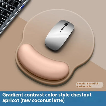 Silicone mouse mat with integrated wrist rest in a gradient blue black colour on a desk.