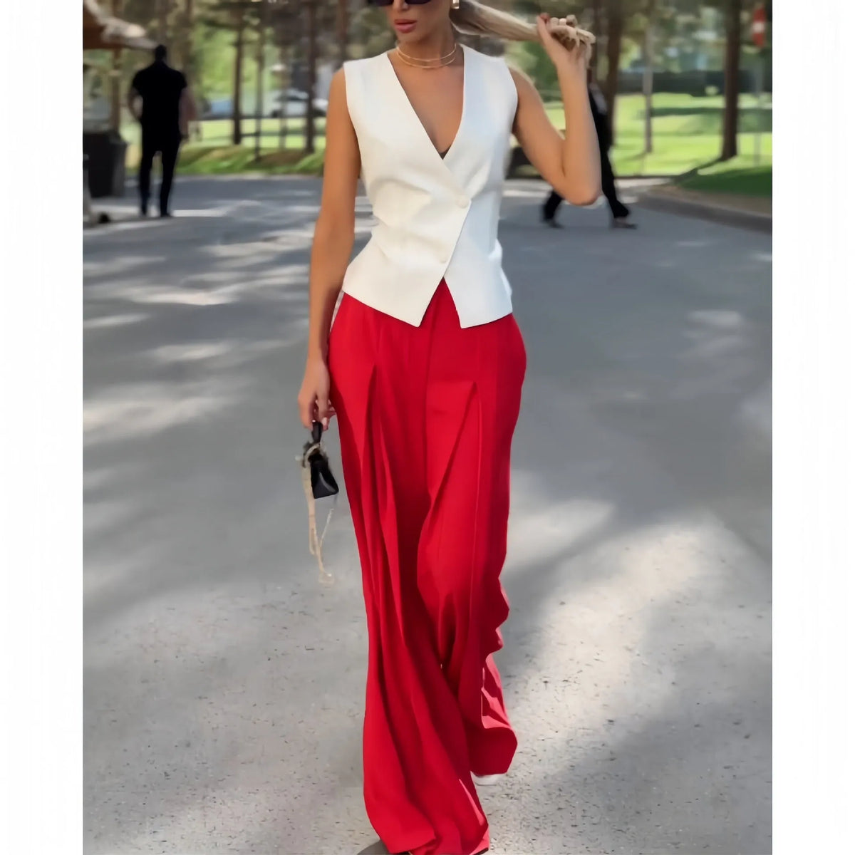 Women's beige polyester two-piece set with deep V-neck sleeveless top and wide-leg trousers