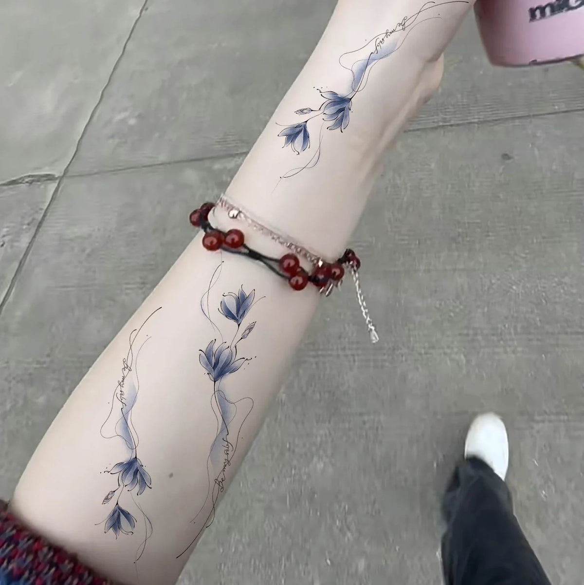 Colourful arm flower temporary tattoo measuring 11.5x4cm with BEMYSELF Be Yourself pattern applied to forearm
