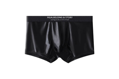 Men's solid colour satin ice silk boxer shorts laid flat, showing mid-waist design.