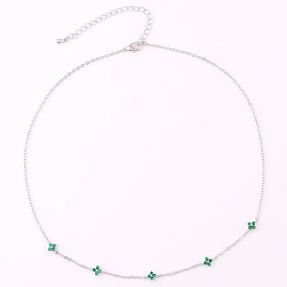 Elegant gold and silver floral necklace with adjustable chain and flower charm, perfect for vacation and beach outfits