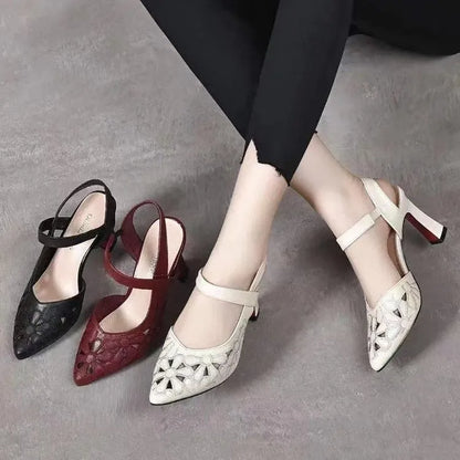 Red women's pointed toe backless sandals with a hollowed toe box and rubber sole