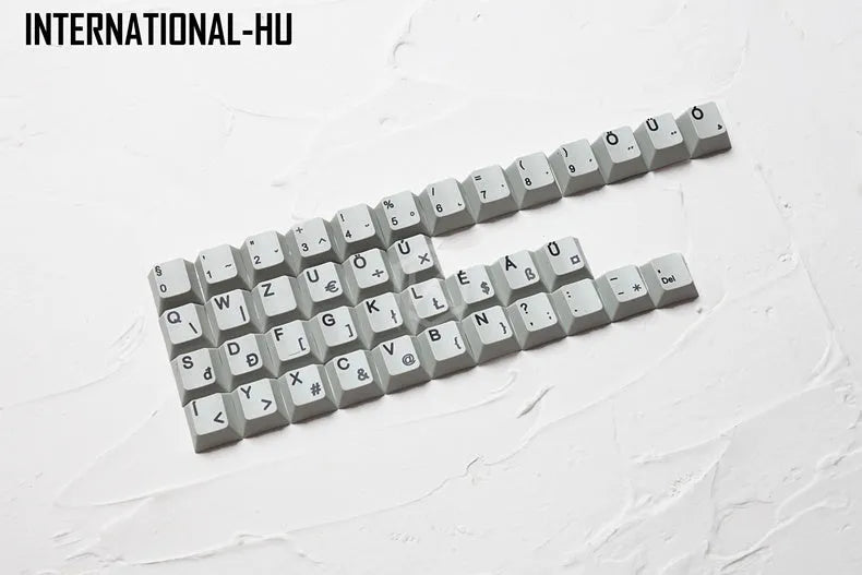 Wired keyboard with international symbol keycaps for ten European language layouts showing USB and PS/2 connections